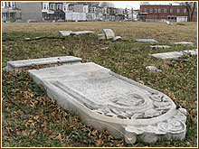 toppled grave stone two